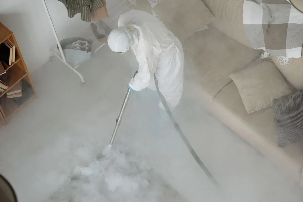 Biohazard cleanup technician in protective equipment, Anthony, KS
